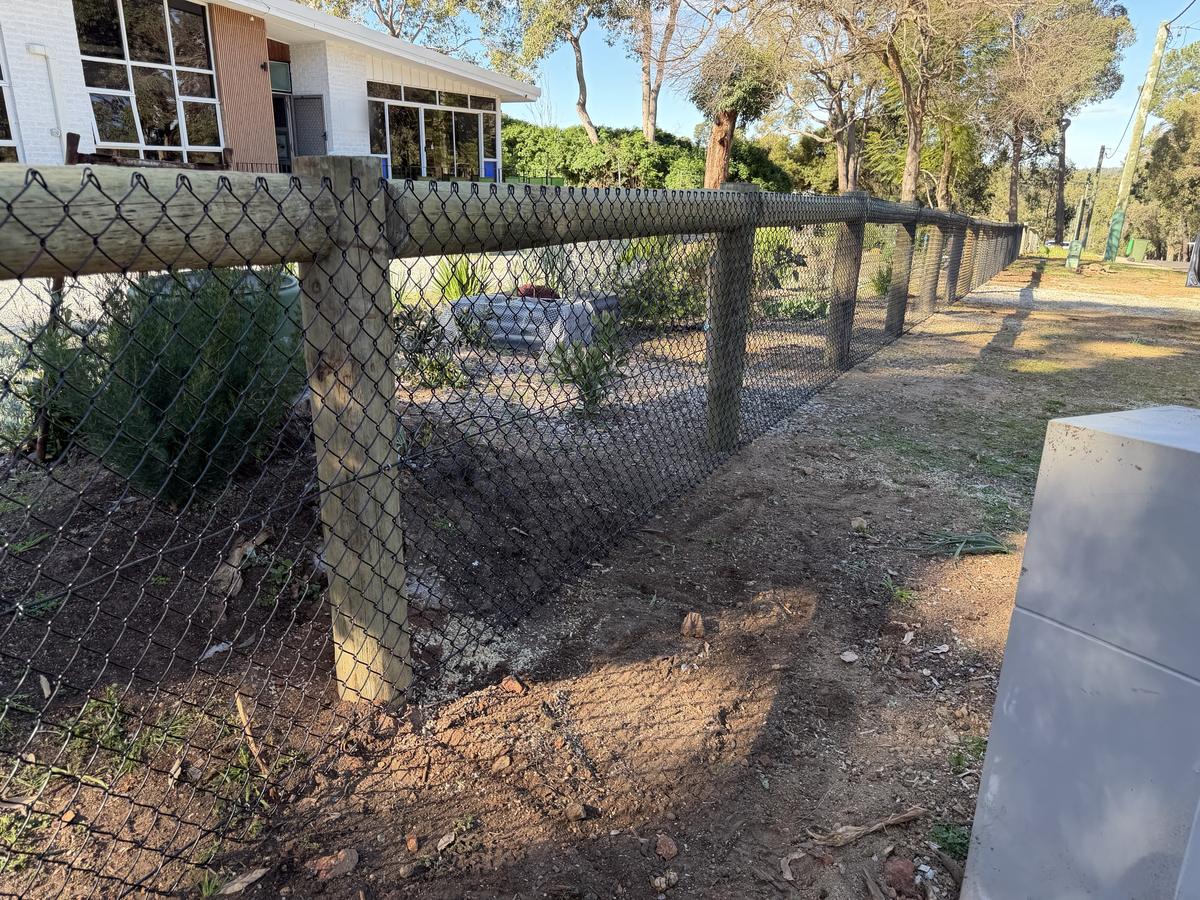 Black chainmesh with timber posts and rail