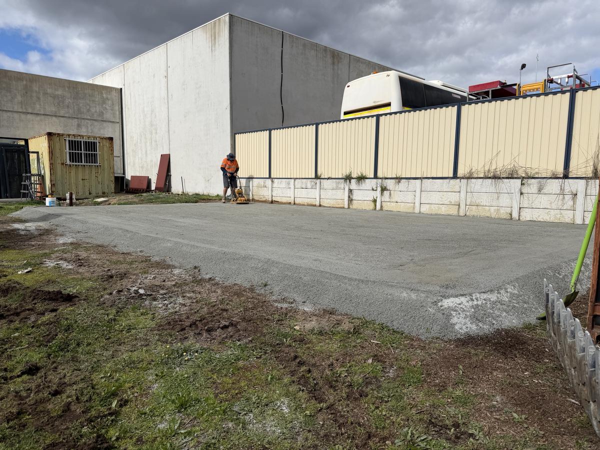 JDM crew member compacting a hardstand