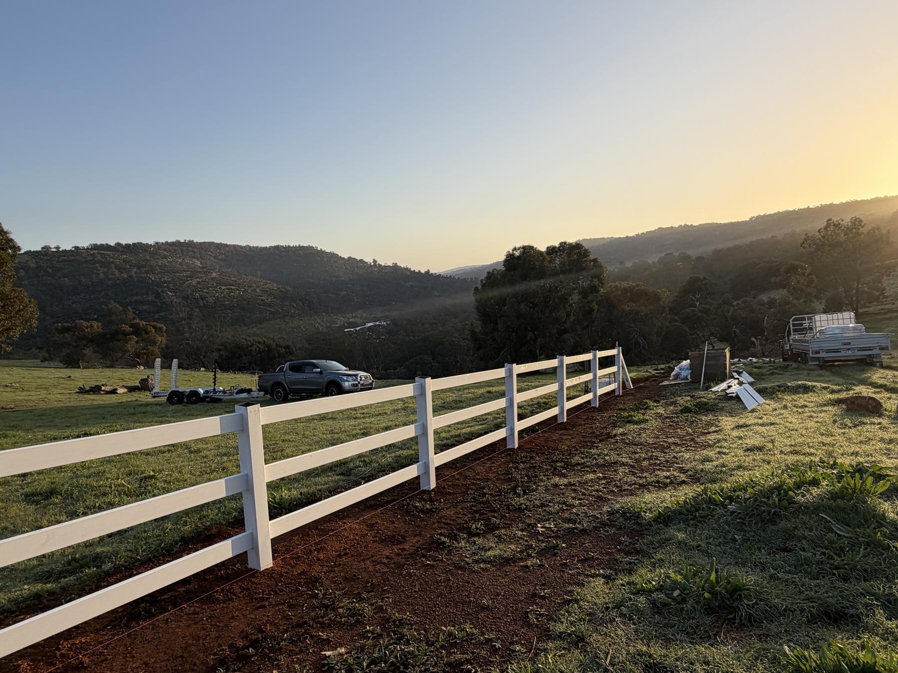 PVC post and rail fence going in on a rural property in the Perth Hills